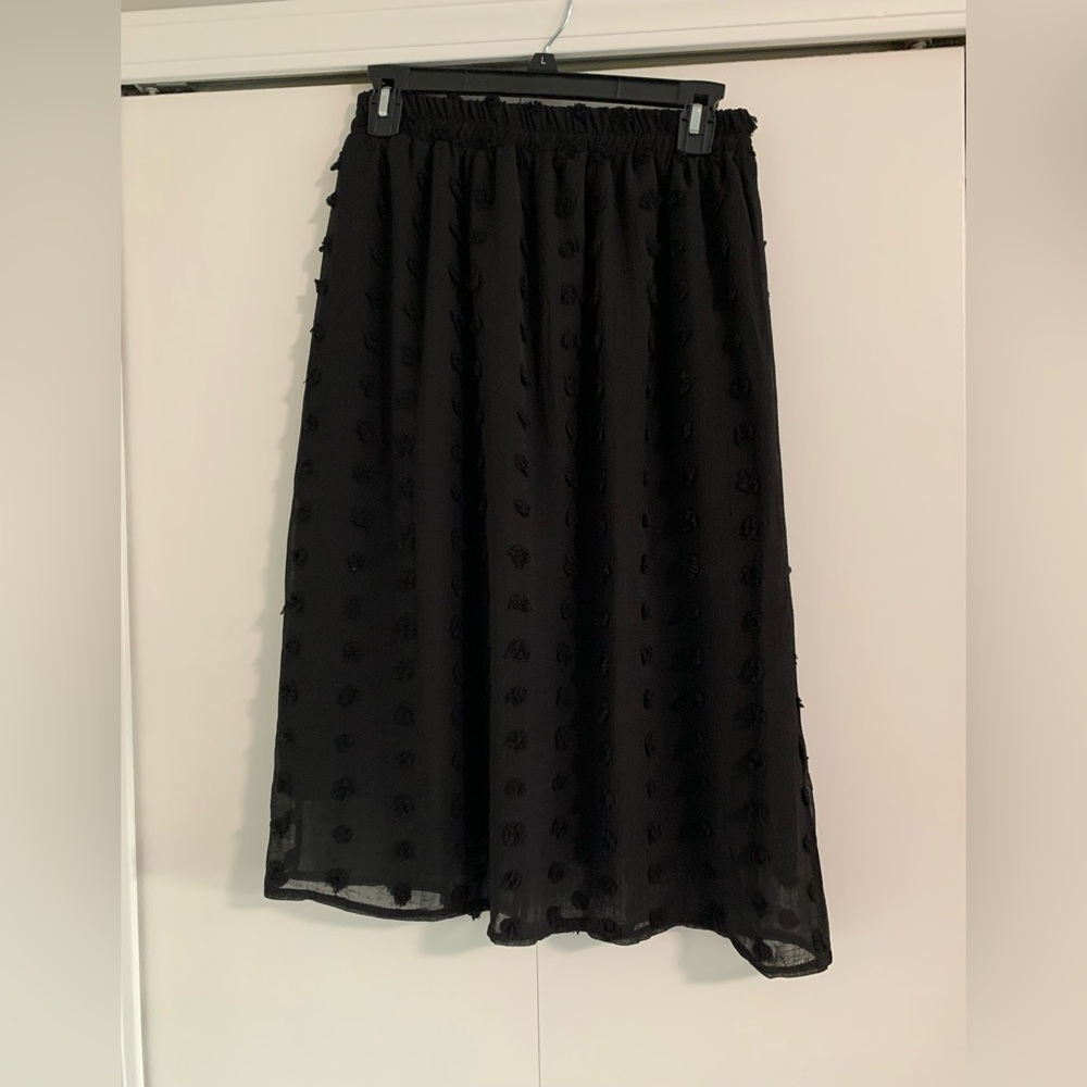 Black skirt with Pom Pom detail. Size small. NWOT